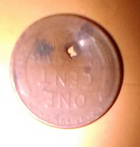 I-Have-Two-Wheat-Pennies-With-Square-Holes-Punched-In-Them.